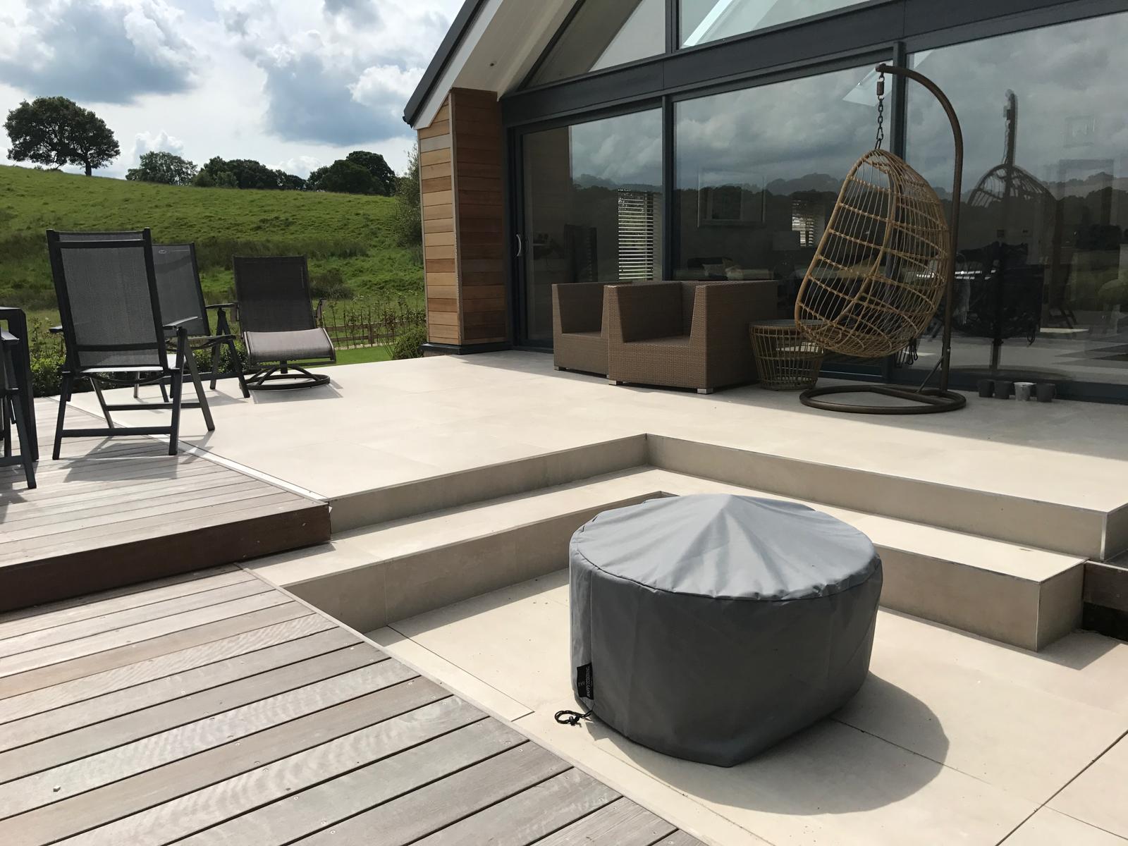 Outdoor terrace in large-format porcelain paving with countryside views
